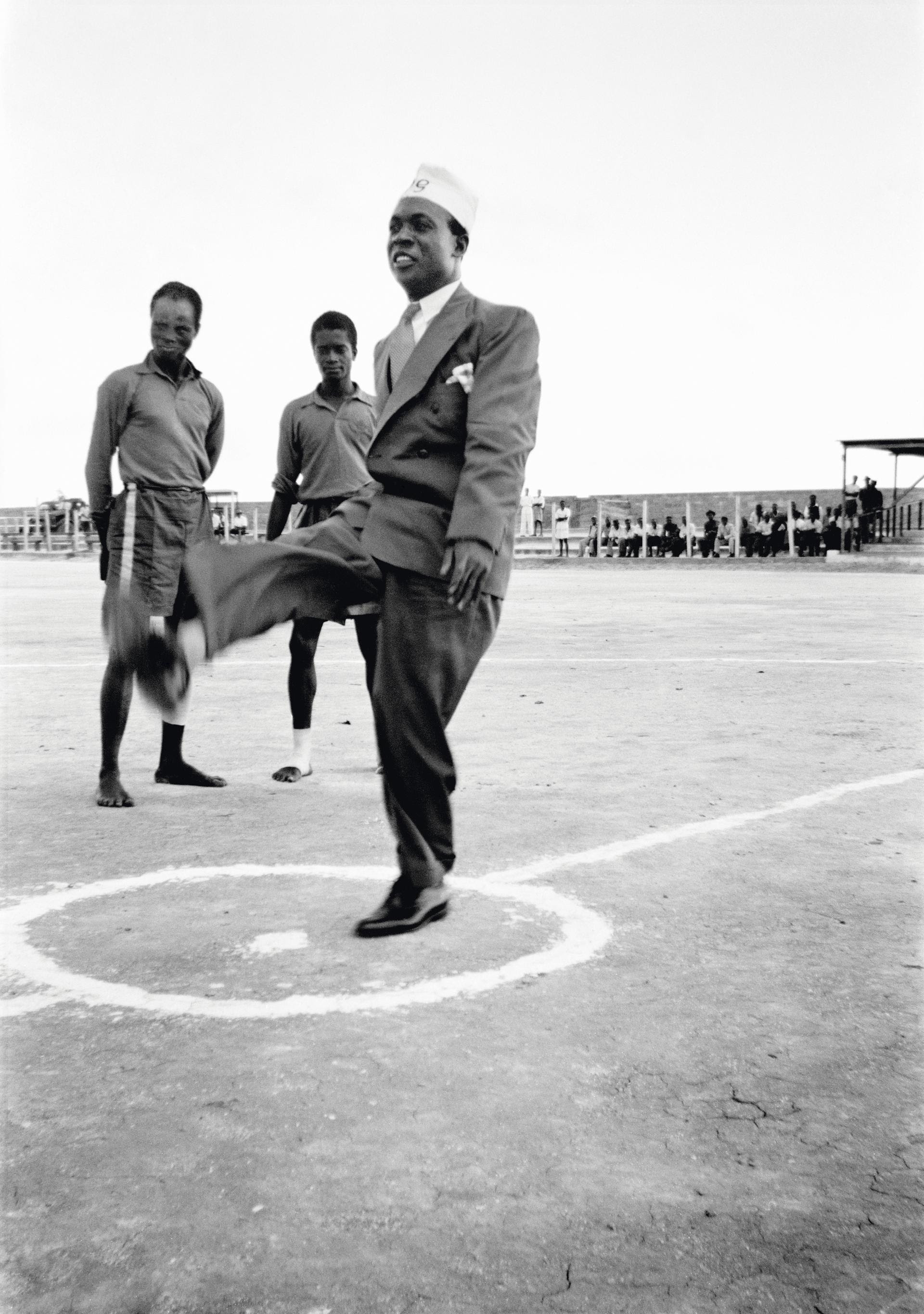 James Barnor, Kwame Nkrumah in his PG (Prison Graduate) cap, kicking a football before the start of an international match at Owusu Memorial Park in Fadama, Accra, 1952 © James Barnor courtesy galerie Clémentine de la Féronnière, Paris ames Barnor/Autograph ABP, London